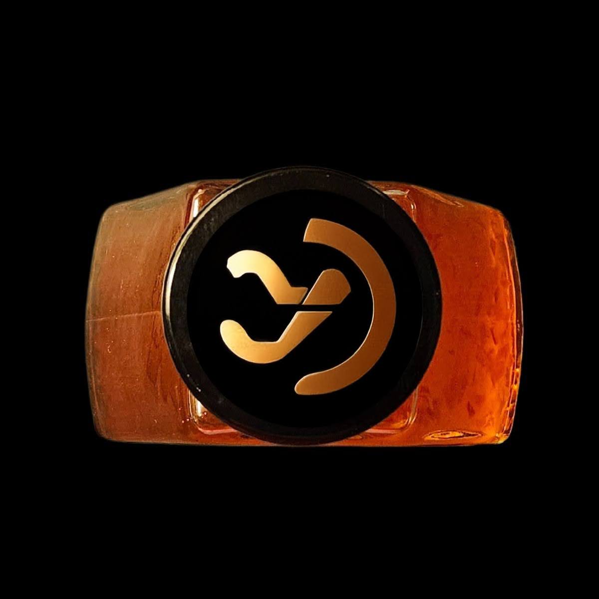 Ring with a black and gold symbol